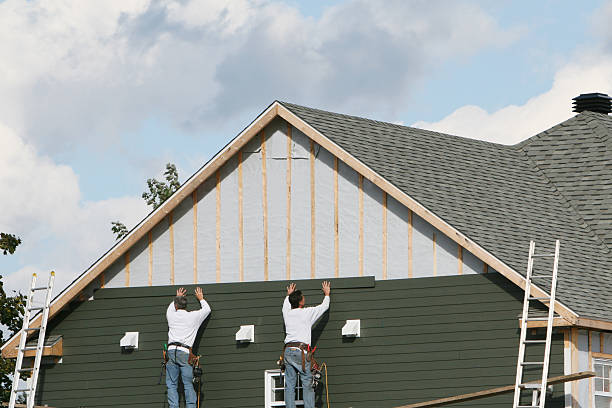 Professional Siding technician working in Millis, MA